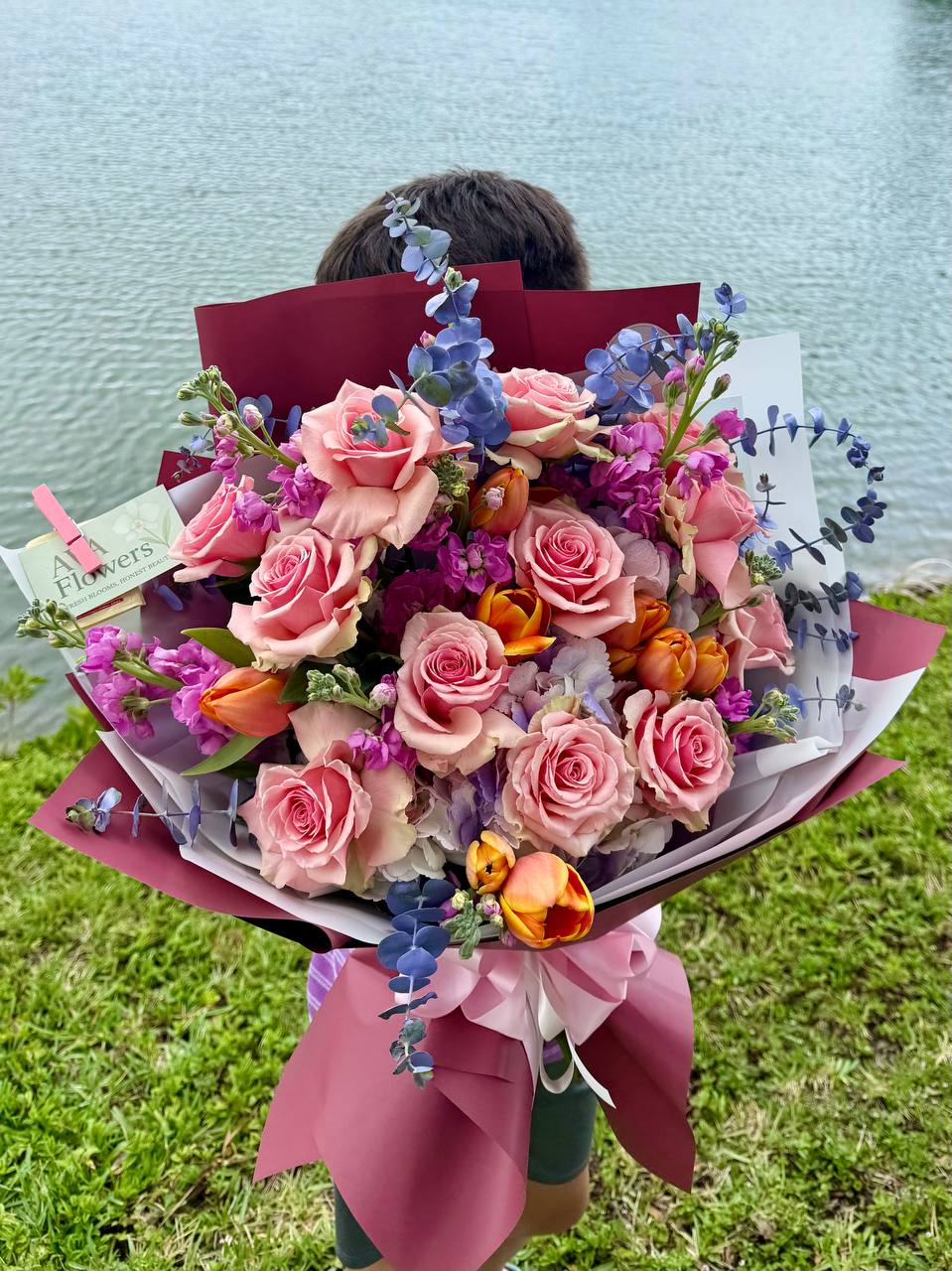 Premium spring flower arrangement with blush roses, tulips, hydrangeas, and eucalyptus by AvaFlowers USA