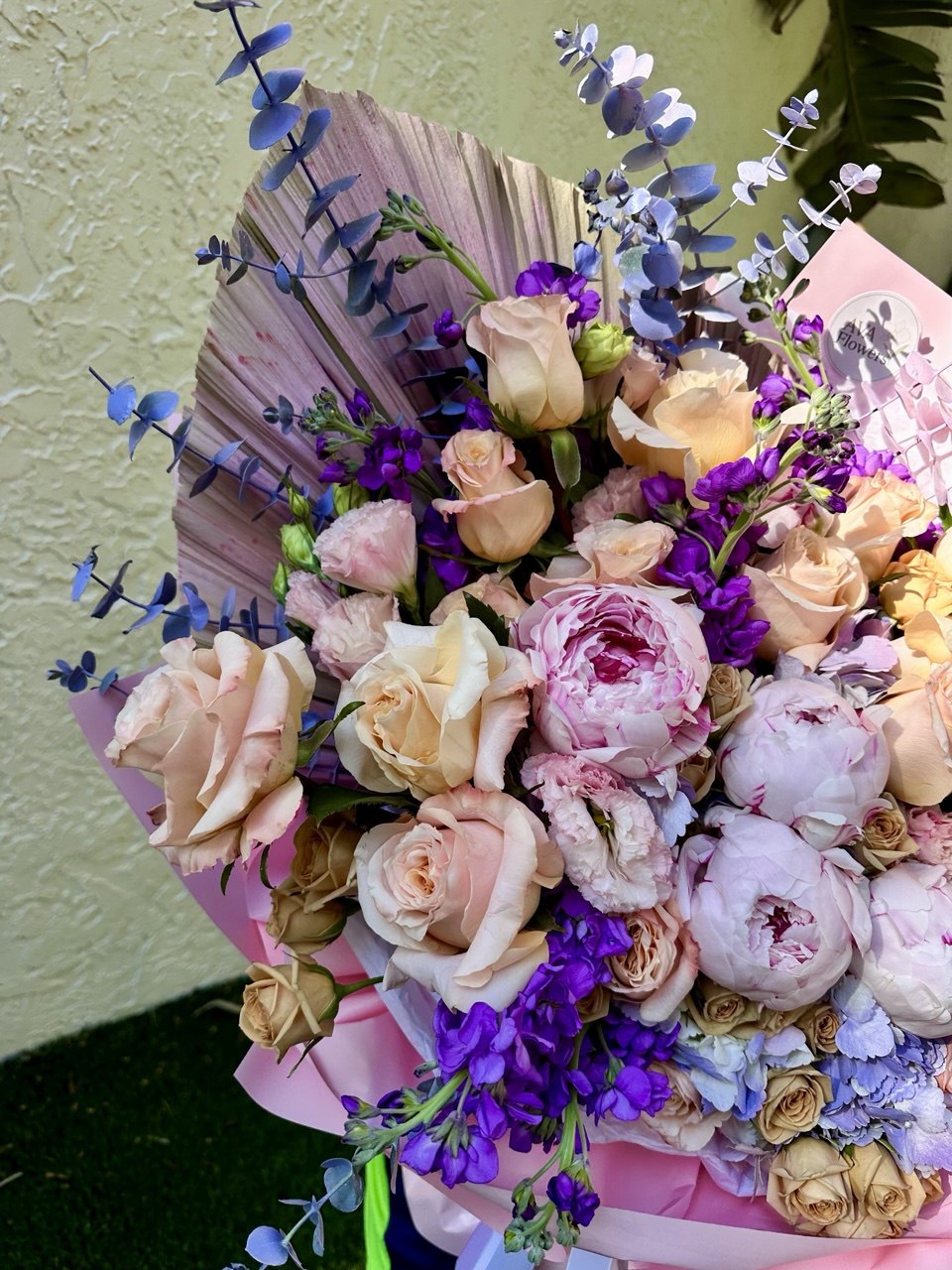 Romantic XL bouquet with blush peonies, peach roses, hydrangea, and eucalyptus in luxury wrapping